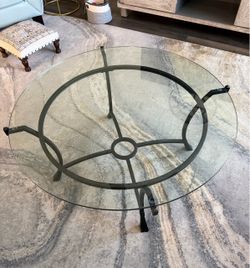40” Diameter glass top coffee table.