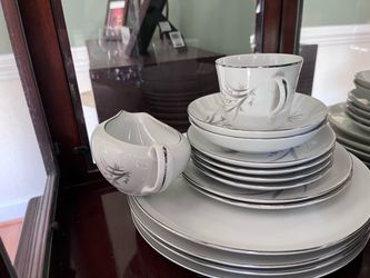White Porcelain Dinnerware Set with Floral Detail