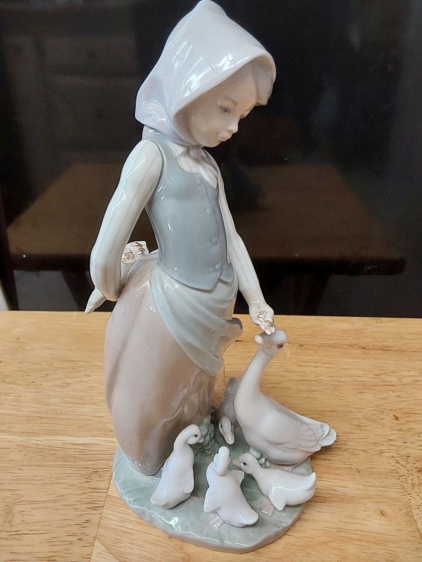 Lladro- Girl Feeding Family Of Geese