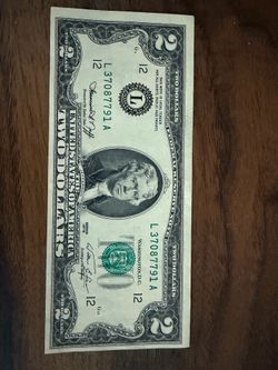 Near mint uneven cut two dollar bill