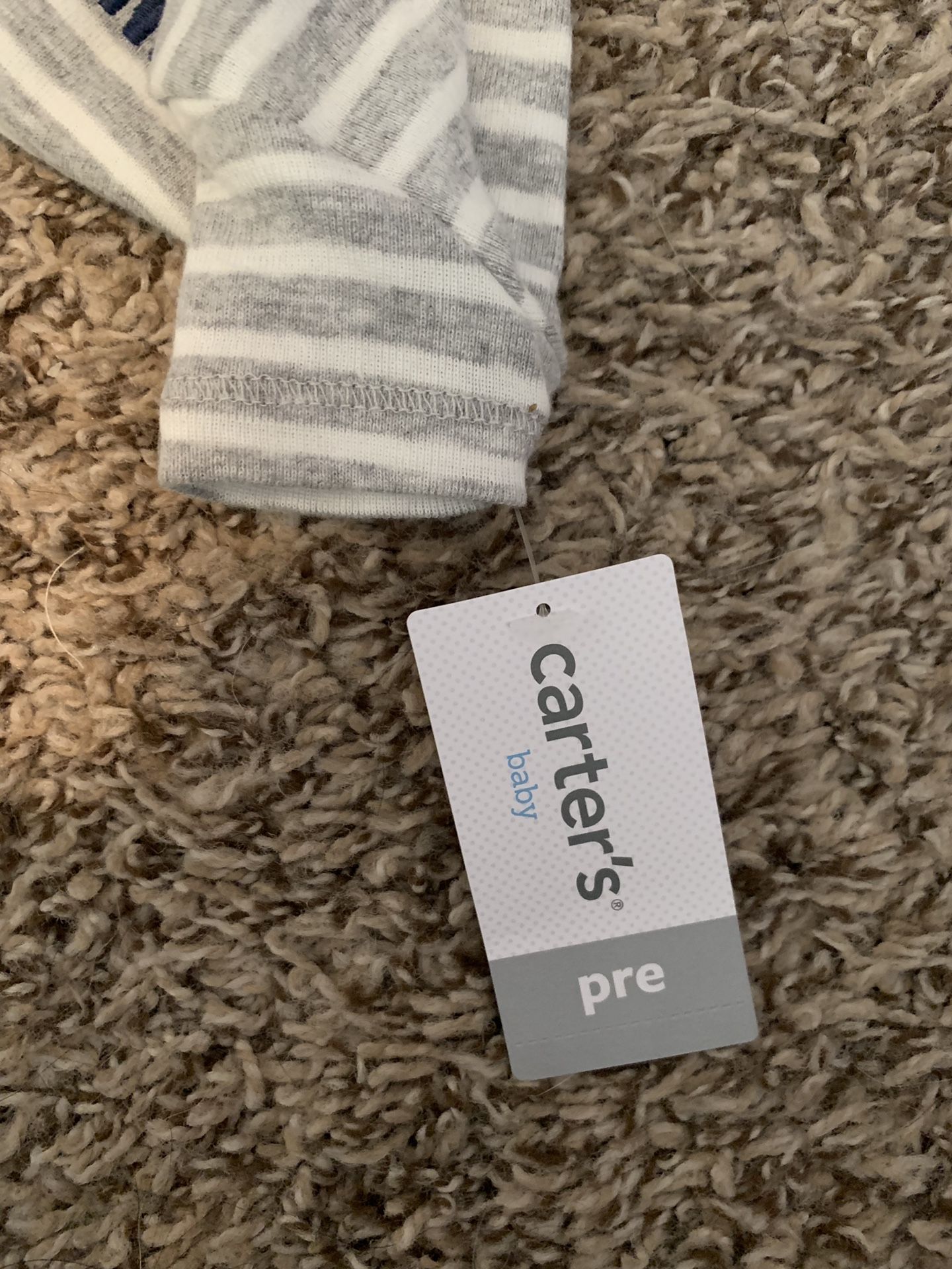 Premi baby outfits tags still on!