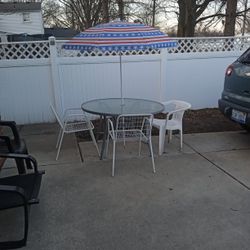Glass Patio Table Three Chairs And Umbrella For One Low Price 