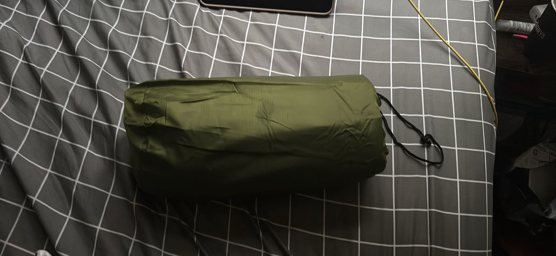 Ultralight inflatable sleeping pad for camping includes built-in pillow and integrated pump.
