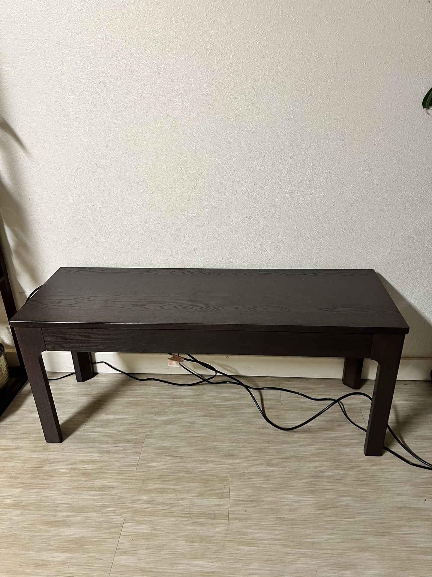 Dark brown wood bench