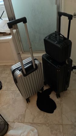 20 inch rolling suitcase, carry-on size with an additional smaller travel packs on top of the ruler sold together at no additional cost a two suitcase
