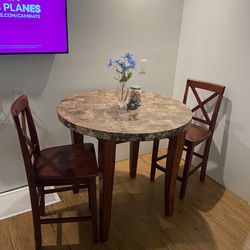 Hightop Granite Table With Two Chairs 