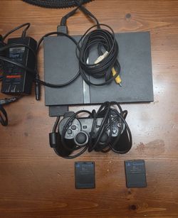 Playstation 2 (PS2) - Slim edition **TESTED AND WORKING*