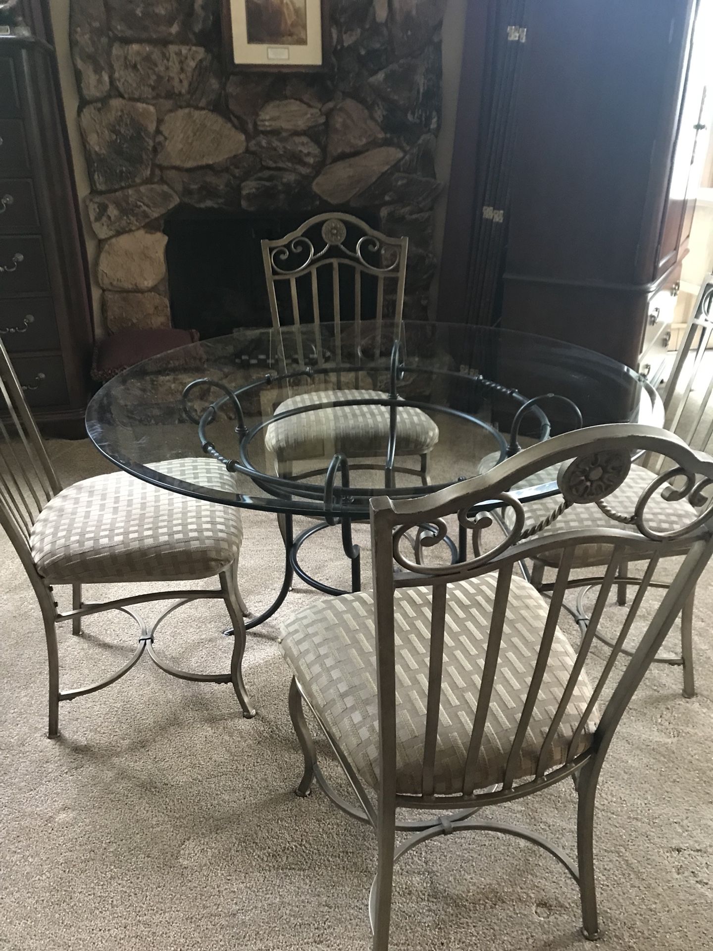 Beautiful gold and black dining room sat with beveled glass on top