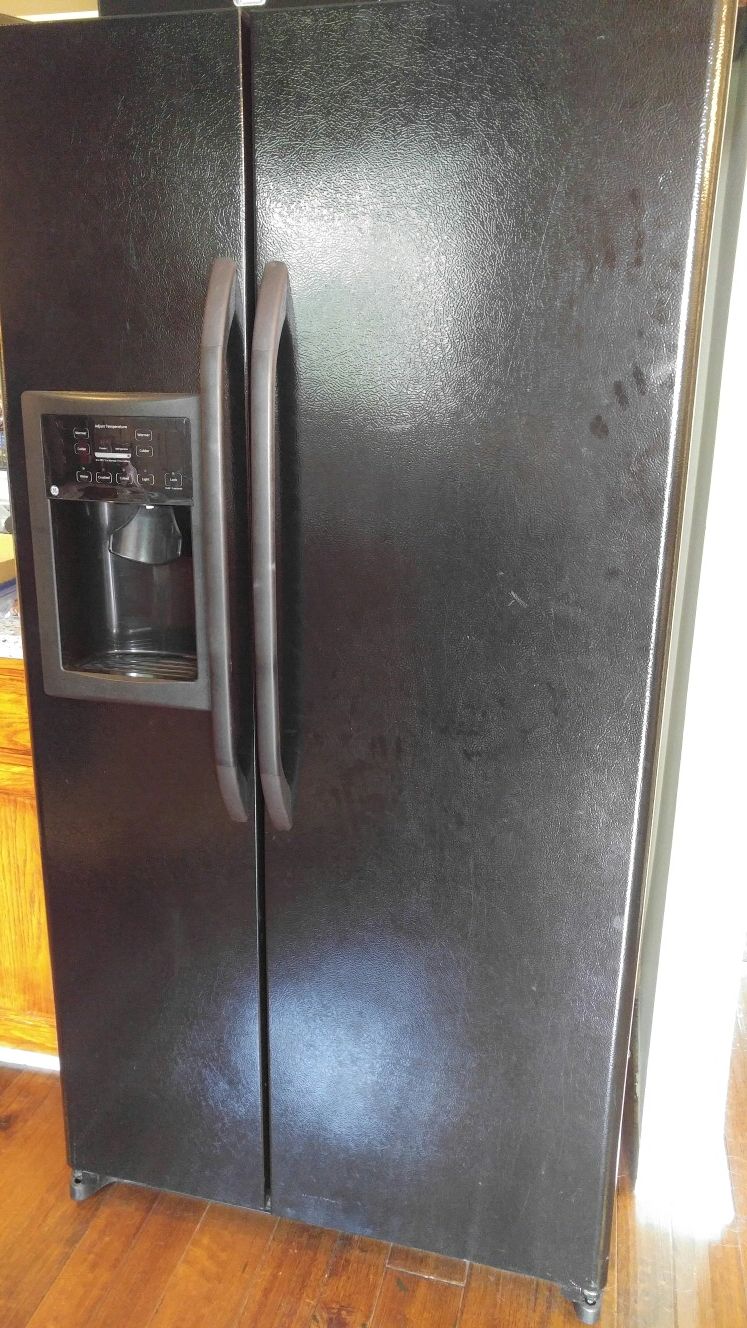 Black refrigerator and freezer, side by side