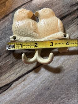 Old cast iron bird hanger