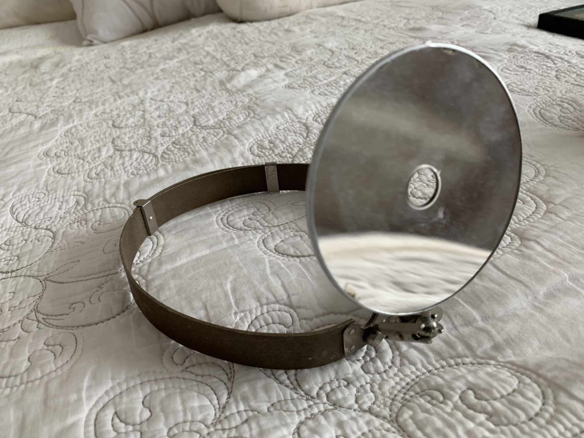 Vintage medical headband mirror for otolaryngologists.