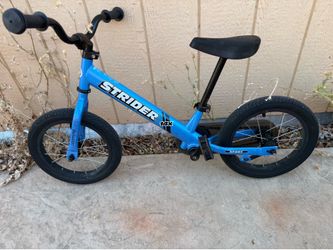 Blue balance bike with wheels