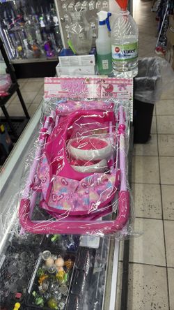 pink ANIVIA baby doll stroller with a heart-patterned fabric and foldable metal frame