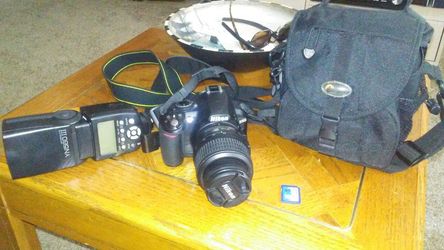 Nikon D3100 with lens 18-55mm