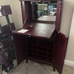 🍷 Elegant Cherry Wood Bar Cabinet with Mirror & Wine Storage 🍷  📍 Pickup Location: Durango and 215  Transform your space with this stunning vintage