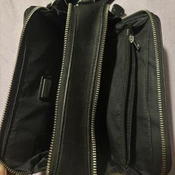 a black Guess Lewistown Double Zip crossbody bag