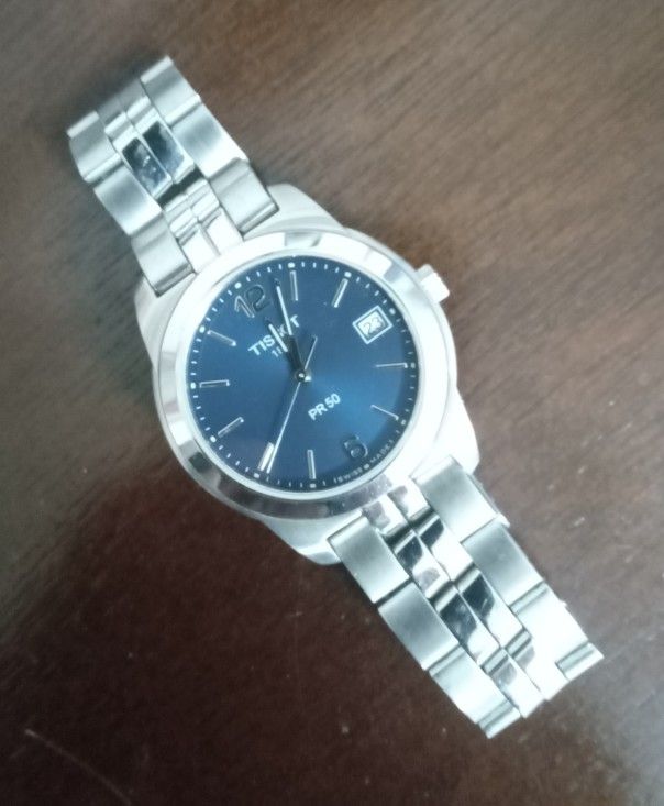 Tissot watch Model PR50 with sapphire crystal and stainless steel bracelet.