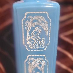 This vintage collectible is a 1965 Jim Beam "Shepherd & Dog" whiskey decanter made of blue slag milk glass. 