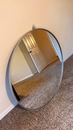 Pemberly Row Modern 42" Round Metal Frame Hooked Mirror in Silver