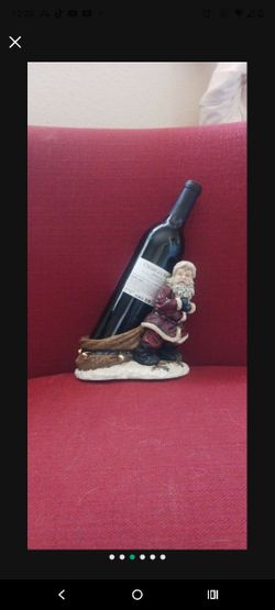 Wine Bottle Holder Santa Claus Pulling Bottle in Bag Sack Kirkland's Holiday
(Bottle not included)