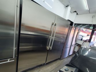 Electrolux  fridge  and freezer  great condition  side by side 66 inches  warranty..use $1350
