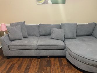 Soft gray couch with hidden compartment and phone chargers