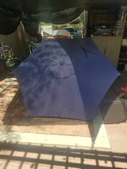 7 ft dark blue  humbrella, sorry no base ,little  Faded, I ASK  $20.00 cash