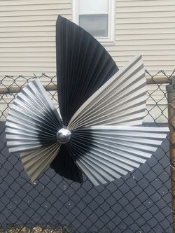 Signed C.C.Jere pinwheel wall sculpture