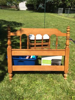 Single bed frame with head and base boards.