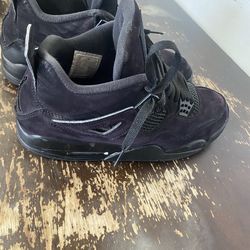 Black cat jordan 4s