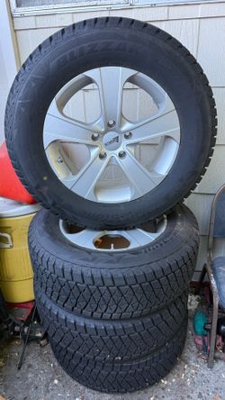 4 Bridgestone Blizzak 245/65R17 mounted on wheels