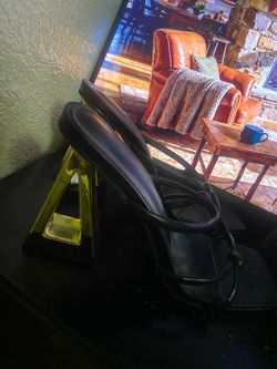 Black pumps and black and gold heel