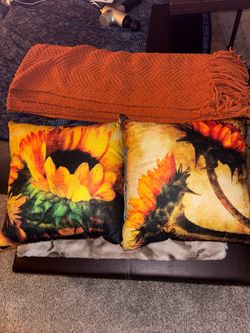 Sunflower throw pillows and blanket