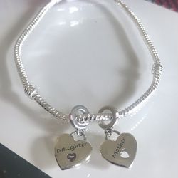 Sterling Silver Charm Bracelet With 2 Charms Attached 