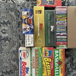 Over probably 15,000 baseball cards from Topps,Fleer, Donruss, upper deck from the 80’s, 90’s and 2000’s. Sealed packs, complete sets, factory sets an