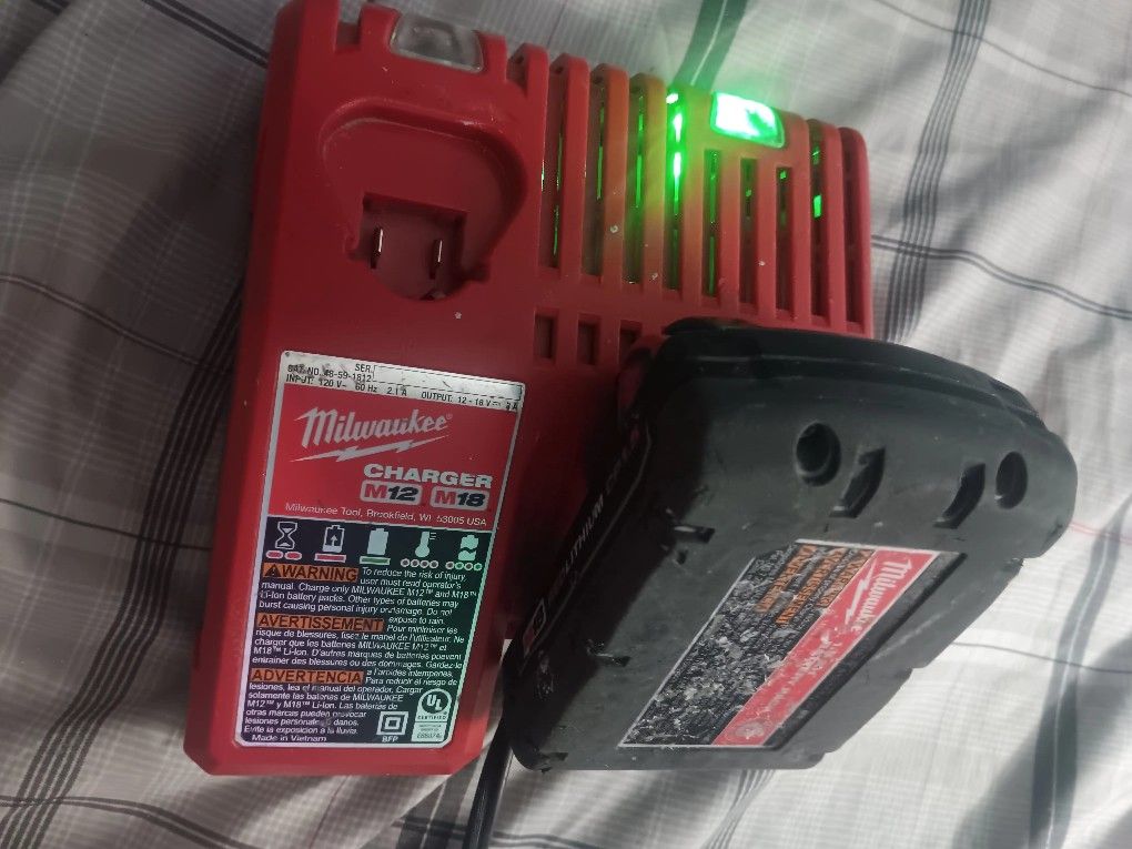 Milwaukee M12 M18 Battery Charger With 1.5 Battery In Good Conditions