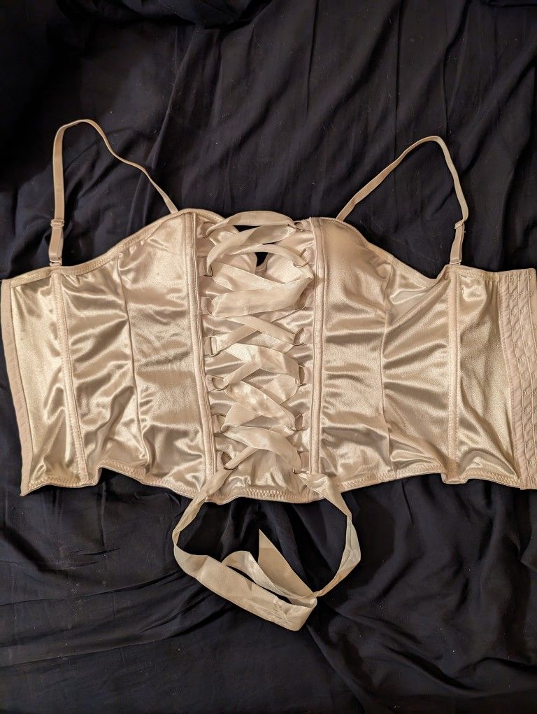 White Nylon Padded Corset by Spirit Size Small, Adjustable, Removable Shoulder Straps. Ribbon Laced Through Gold Loops to n the Front. 13 Hooks, 3 Set