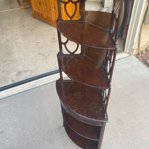 Unique corner curio cabinet/shelf.