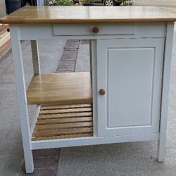 white kitchen cart with a wood top and a drop-leaf extension Island Kitchen Table