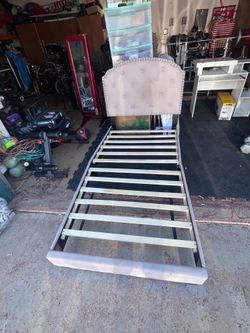 Twin bed frame with mattress and memory foam topper