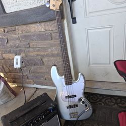 Squier silver electric bass guitar