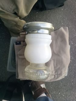 Vintage indoor outdoor anywhere ceiling light fixture and  milk glass with clear  glass bulb cover. Very 50's