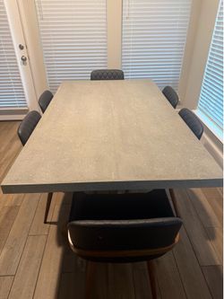 Concrete table with six chairs