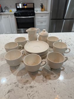 White Ceramic Tea Set with Cups and Saucers