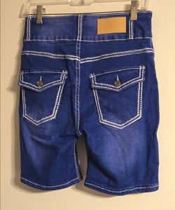 A Pair Of blue denim shorts with pockets