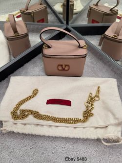 Several authentic luxury handbags.