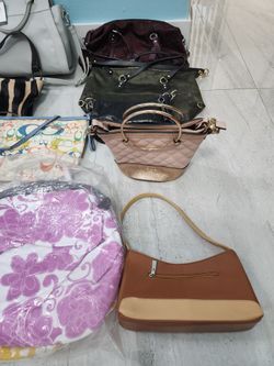 women pursesWomen's purses of different brands: West, Coach, Dune, Maurizio Tautini
