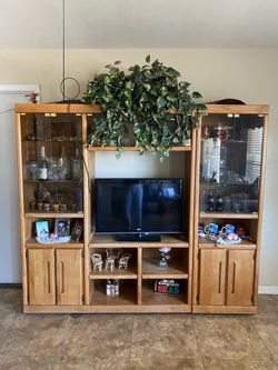 Tv stand with open glass windows and doors