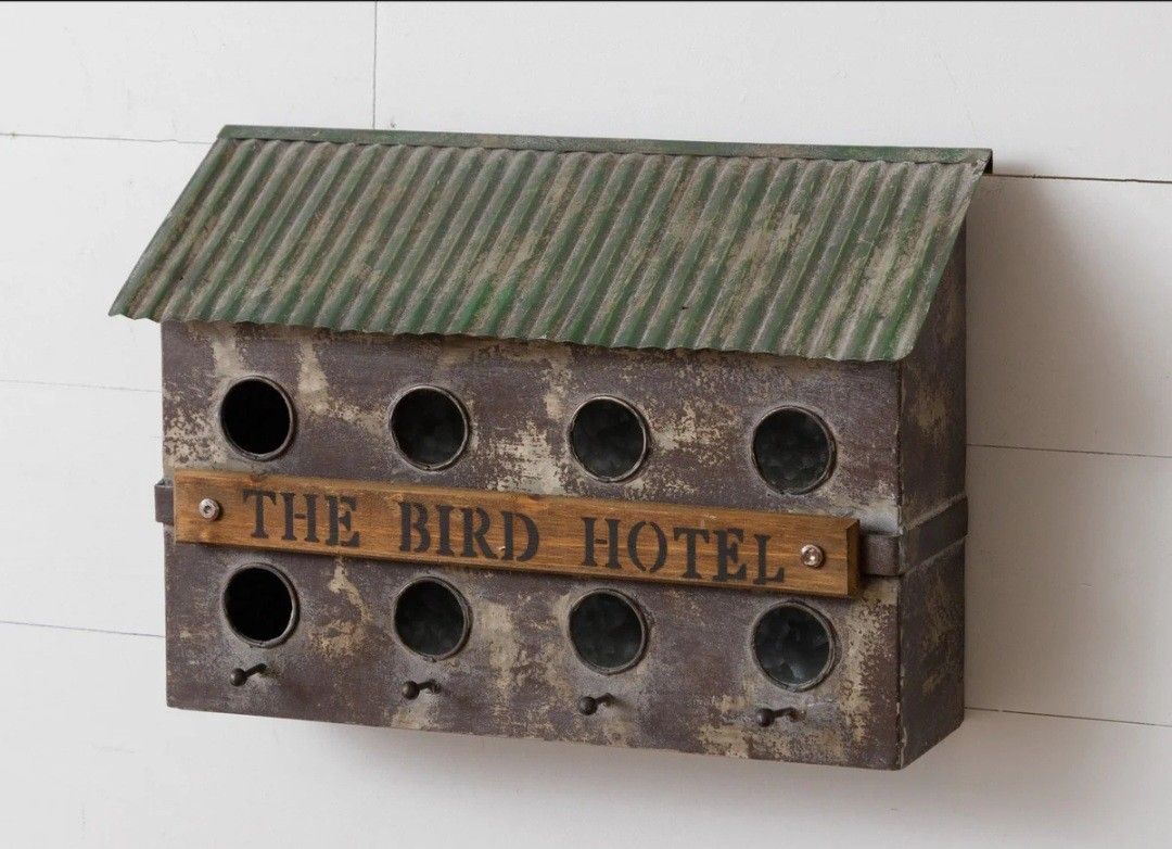 Add This 8 Hole Metal Bird Hotel to your birdhouse collection for a perfect touch of nature-inspired charm....asking $40.00