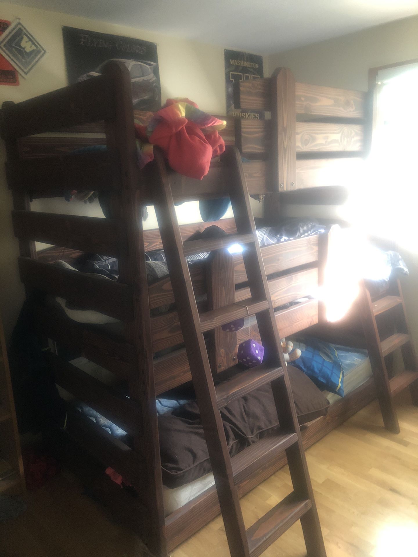 Triple decker bunk bed with ladders